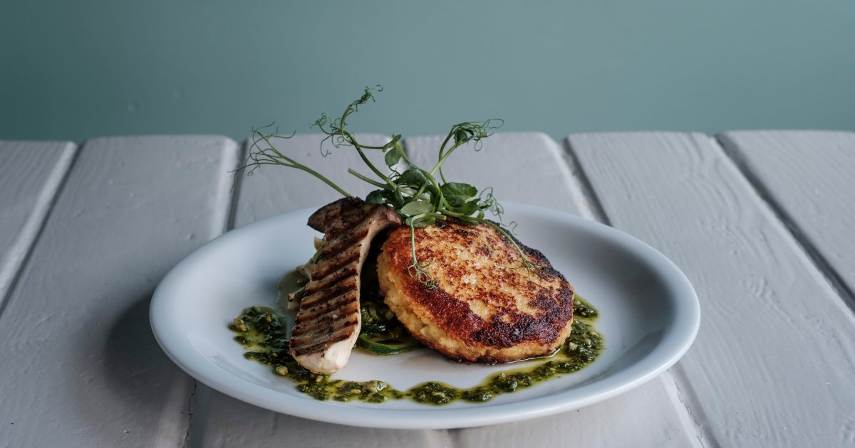 Stuffed couscous cake with courgette linguine, pesto and grilled cep